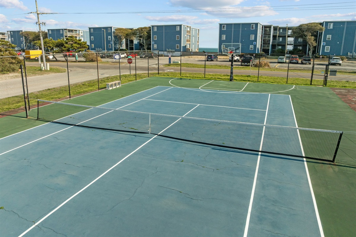 Multi-use court with basketball hoop for fun games with family and friends