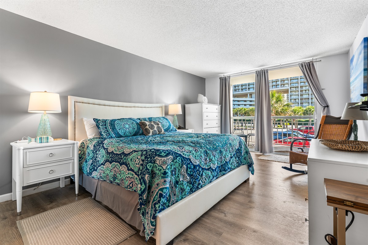 Spacious Main Bedroom with king bed, en suite and balcony access