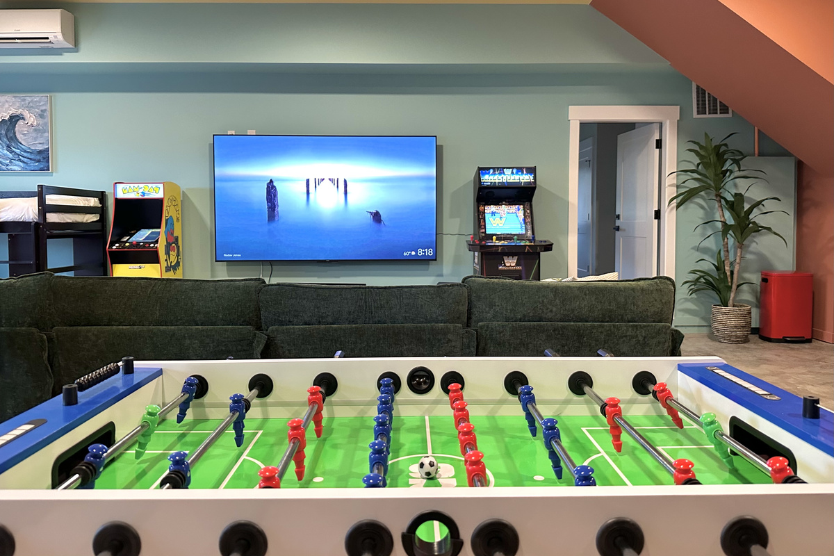 Trade trash talk at the foosball table while the big screen plays behind you — the fun room doesn't slow down after dinner.