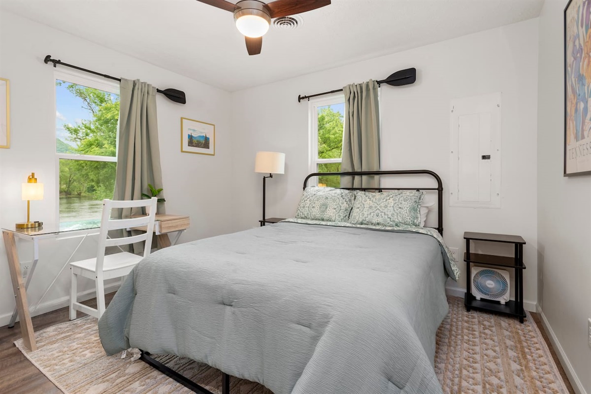 Bedroom 1 features a queen size bed with a very comfortable mattress. The view of the French Broad River is definitely worth writing home about.