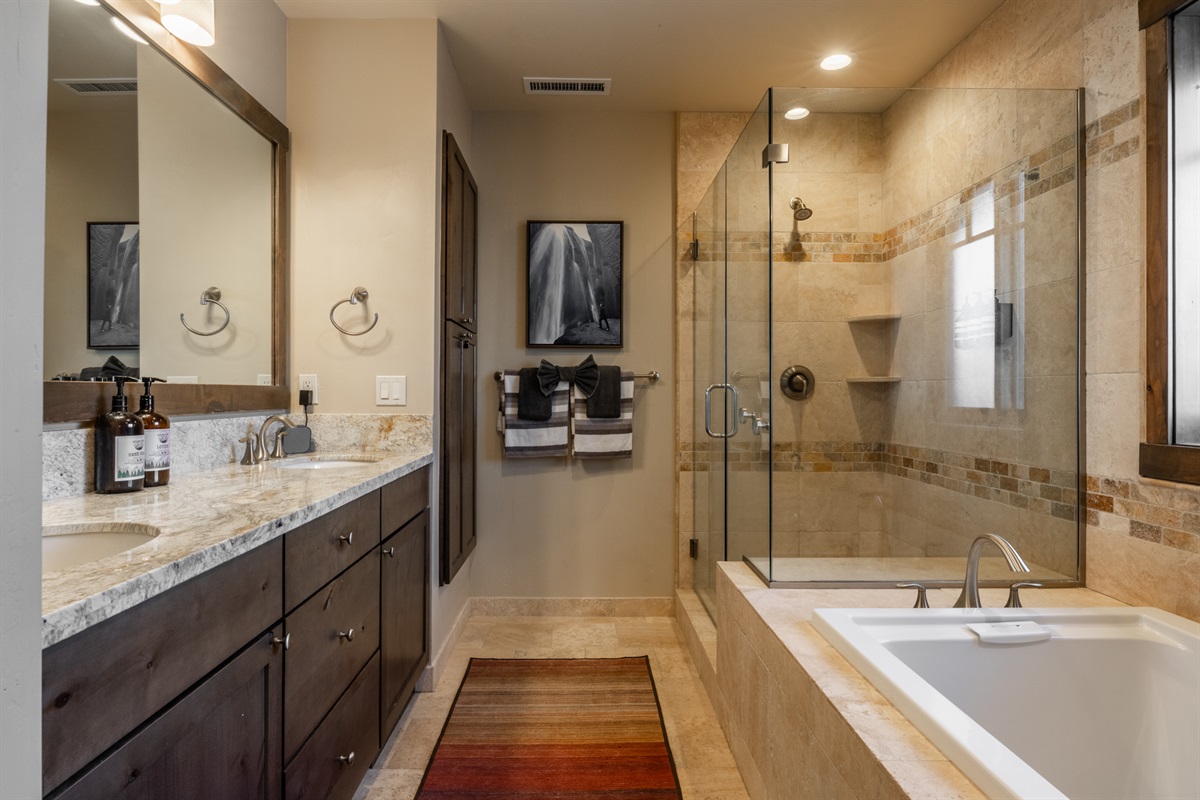 Unwind in the soaking tub or refresh in the walk-in shower, with the added comfort of a private toilet room for convenience.