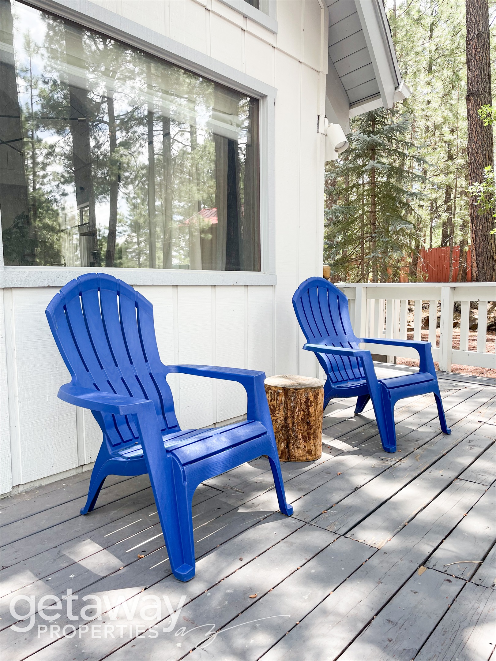 Relax in Adirondack chairs and dine outdoors with peaceful forest views.