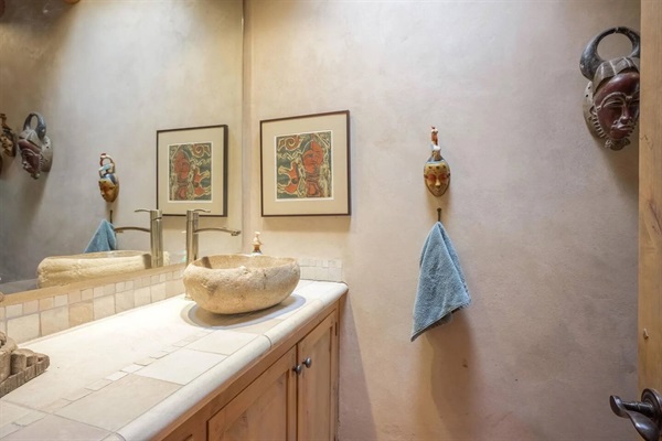 Powder room is also a full bathroom with a bathtub.