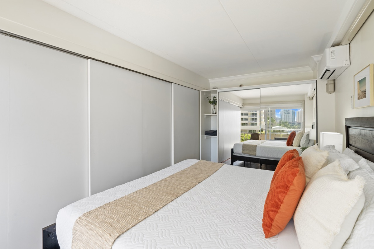 Sliding partition doors can be closed to separate bedroom from the living area for privacy. 