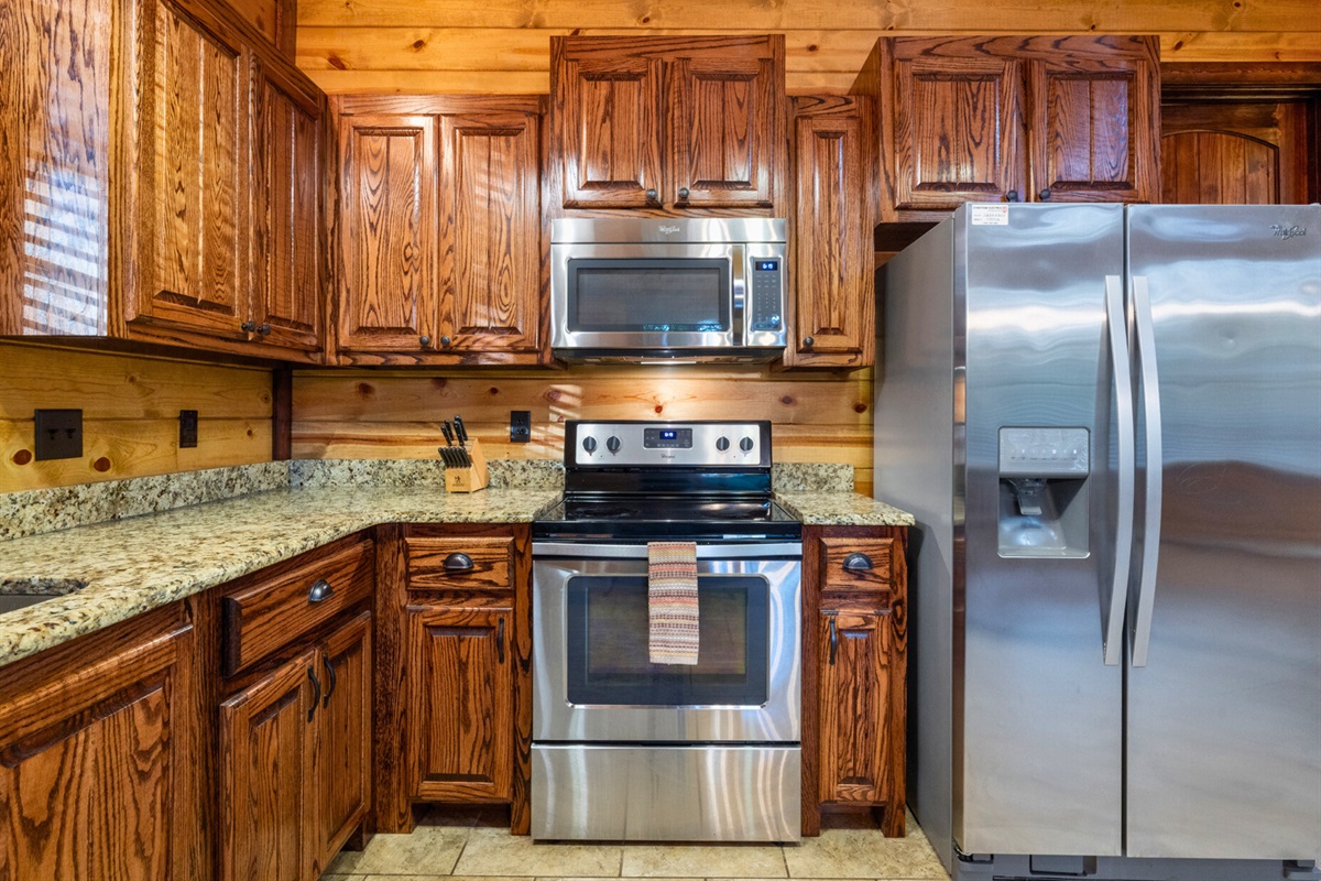 Rustic charm meets comfort inside, with stone fireplace, warm wood, and space to gather after a day exploring.