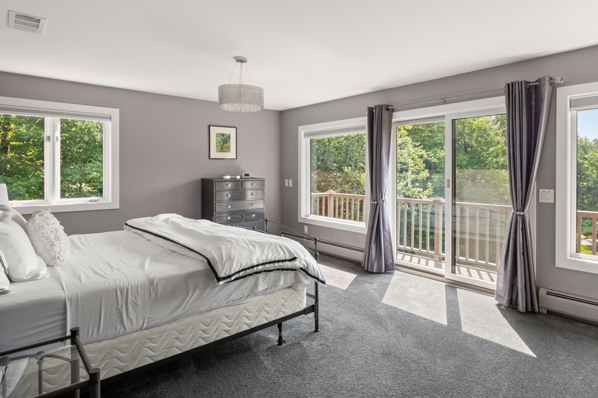 Primary bedroom with balcony