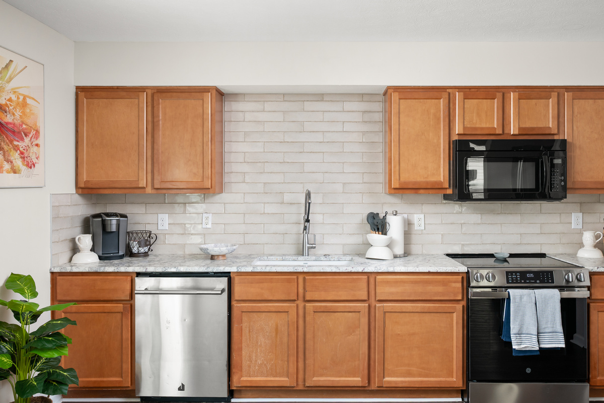 With plenty of counter space, the kitchen makes meal prep easy whether you're cooking a family dinner, setting out snacks for race day, or brewing your morning coffee.