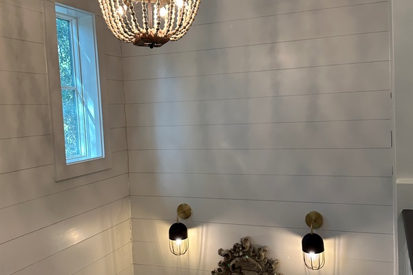 Staircase down to living, dining and kitchen areas
