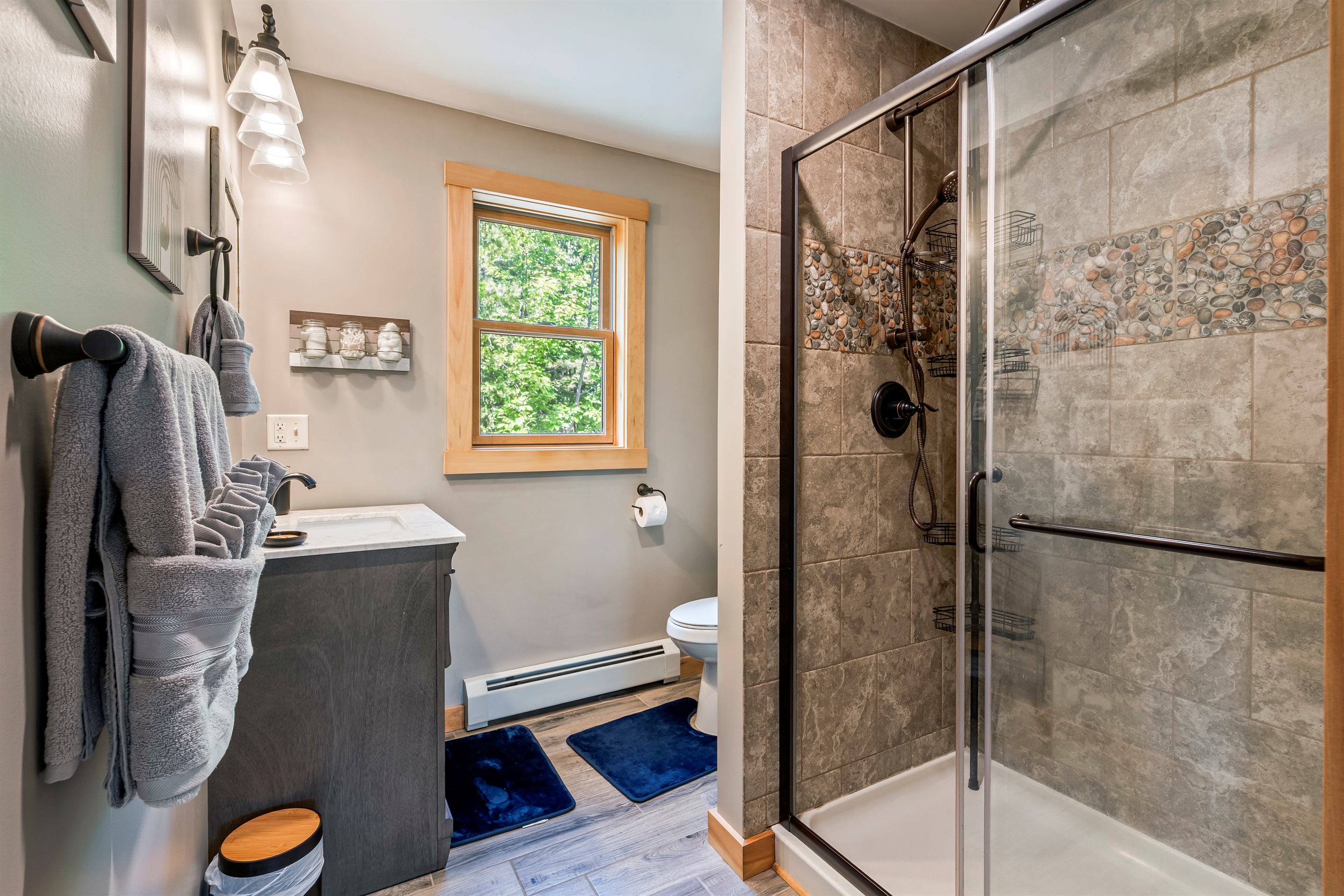 Ensuite bathroom with walk-in shower and modern finishes.