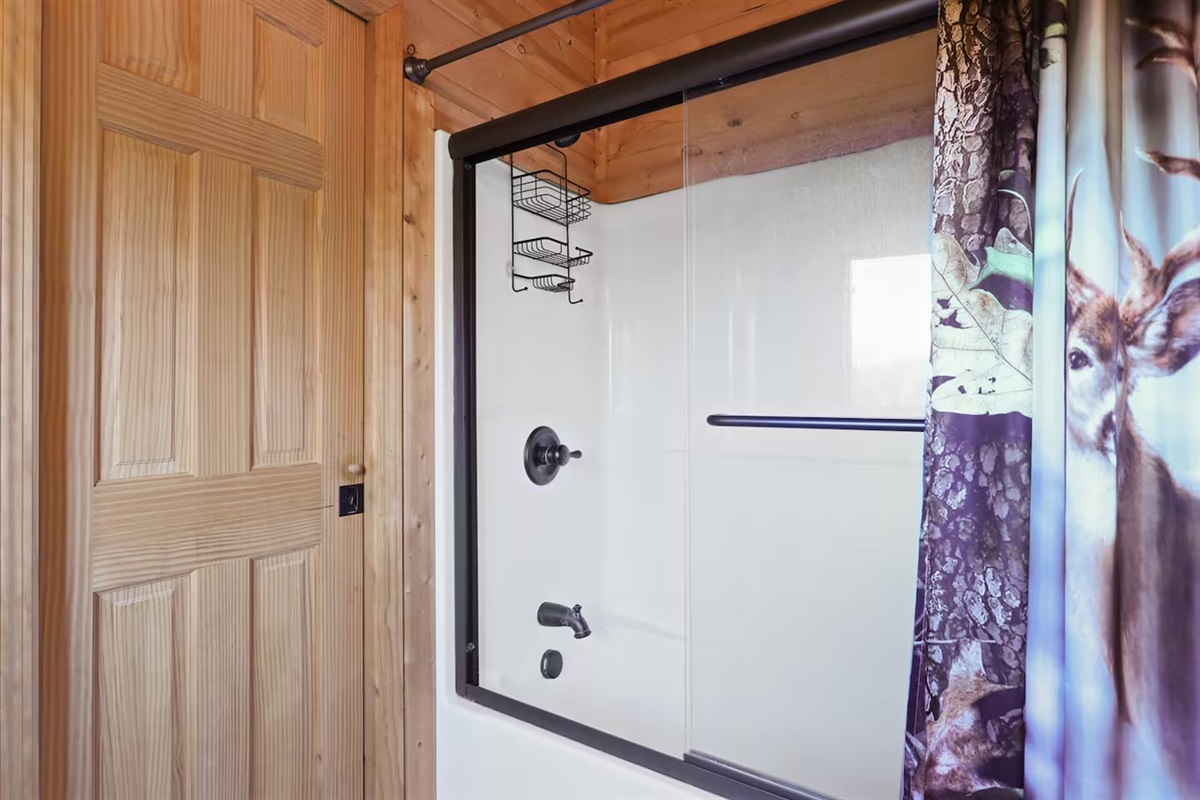 Tub and shower in Bathroom #3 on second floor
