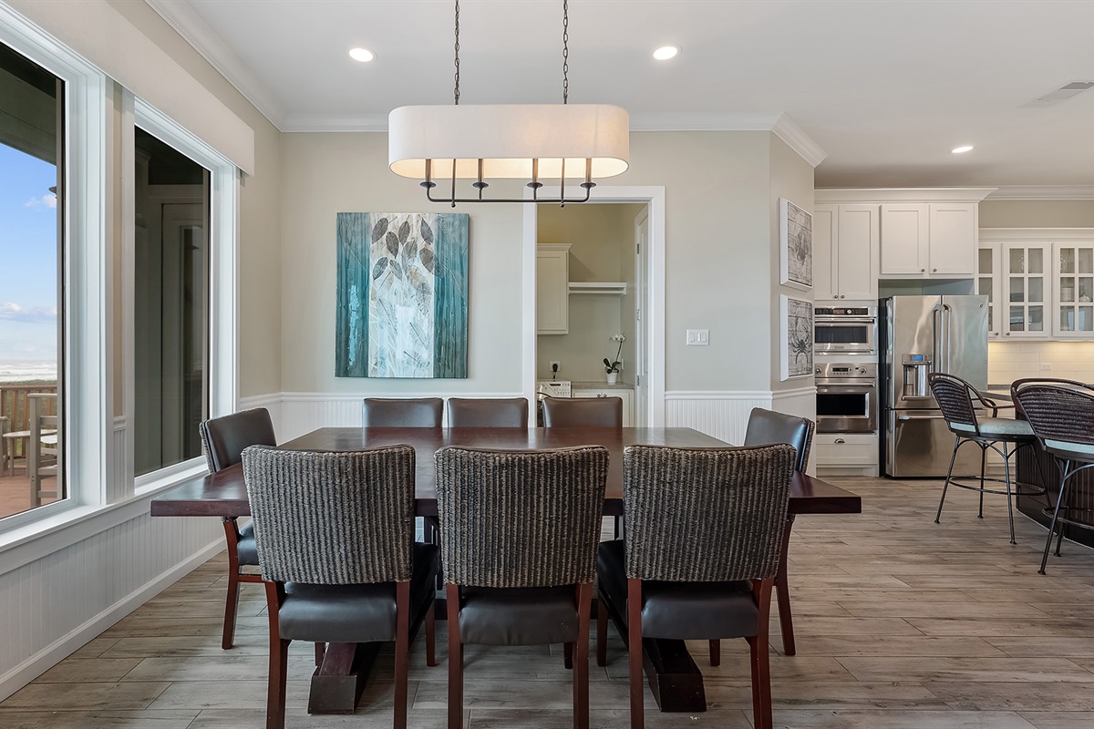Dining Room: Comfortably seats 8 with scenic beach views.