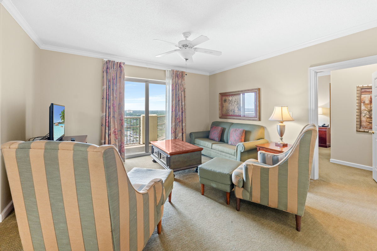 Open Livingroom with sleeper sofa and balcony access