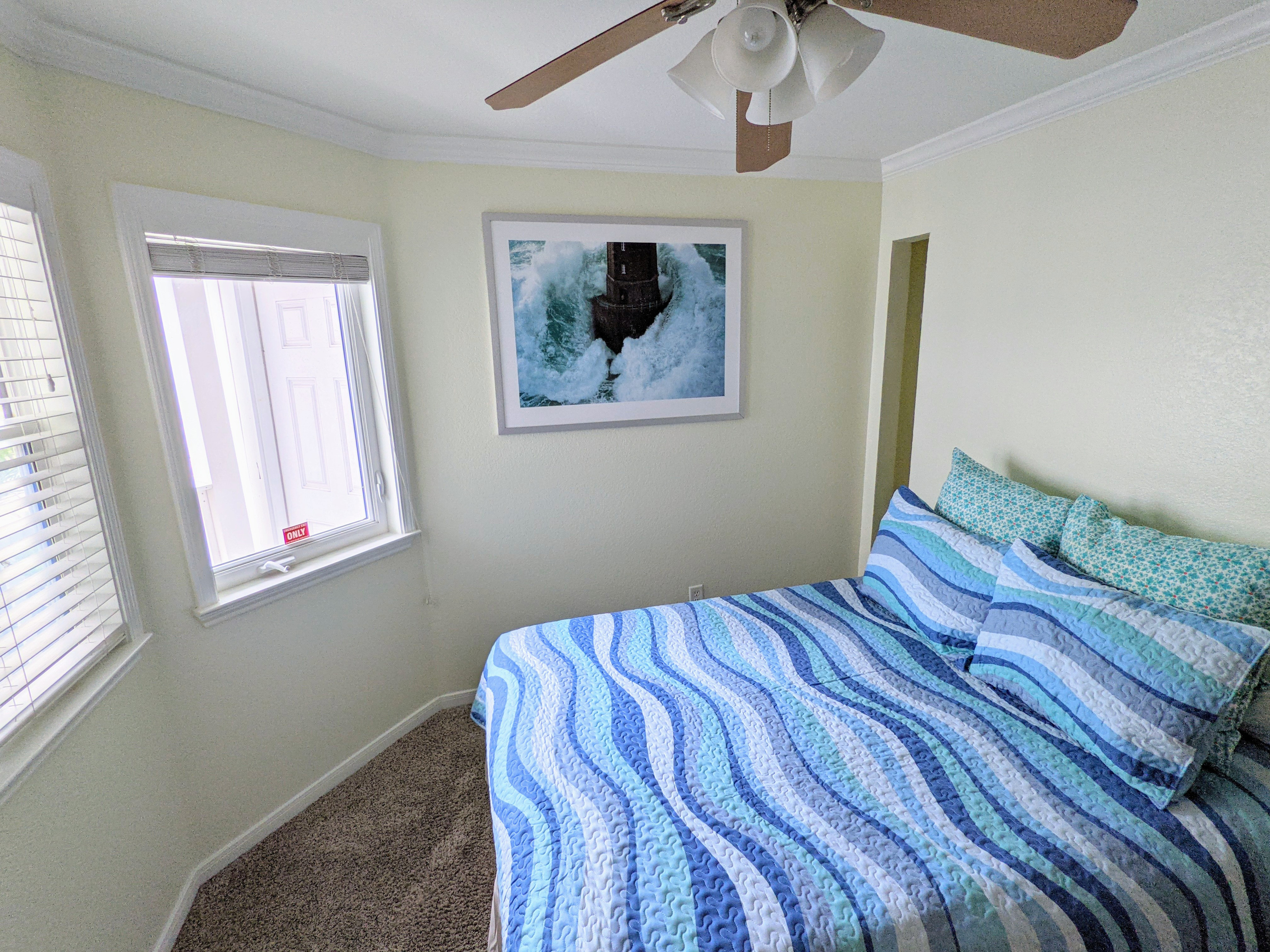 Guest bedroom with queen-sized bed.