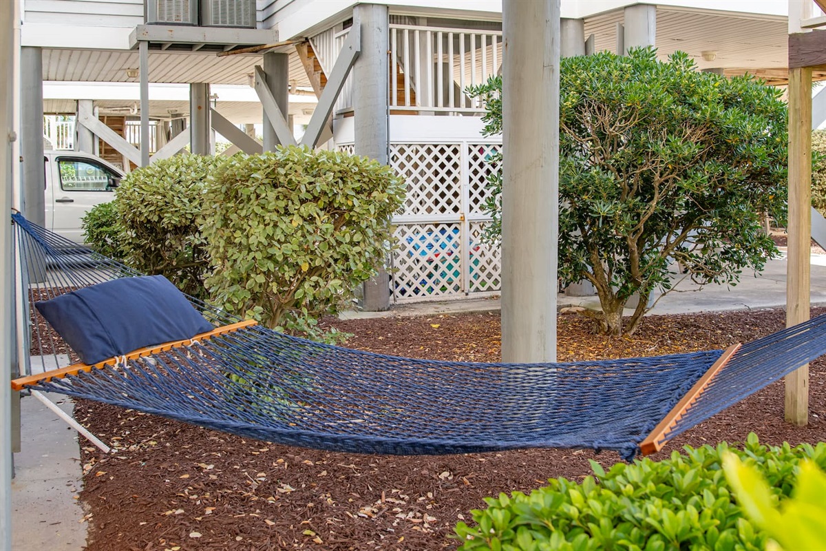 Relax in the shade on this comfy hammock. 