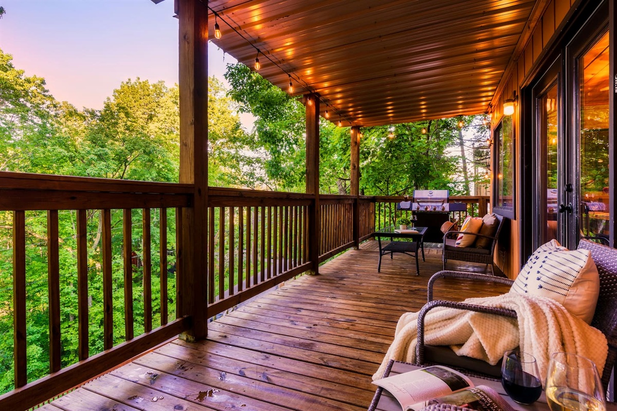 The main level porch with hot tub, seating and a propane grill - conveniently located right off the kitchen and main living room.