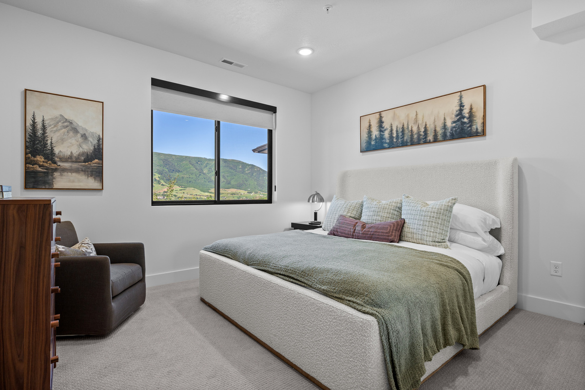 Spacious bedroom offering comfort and tranquility.
