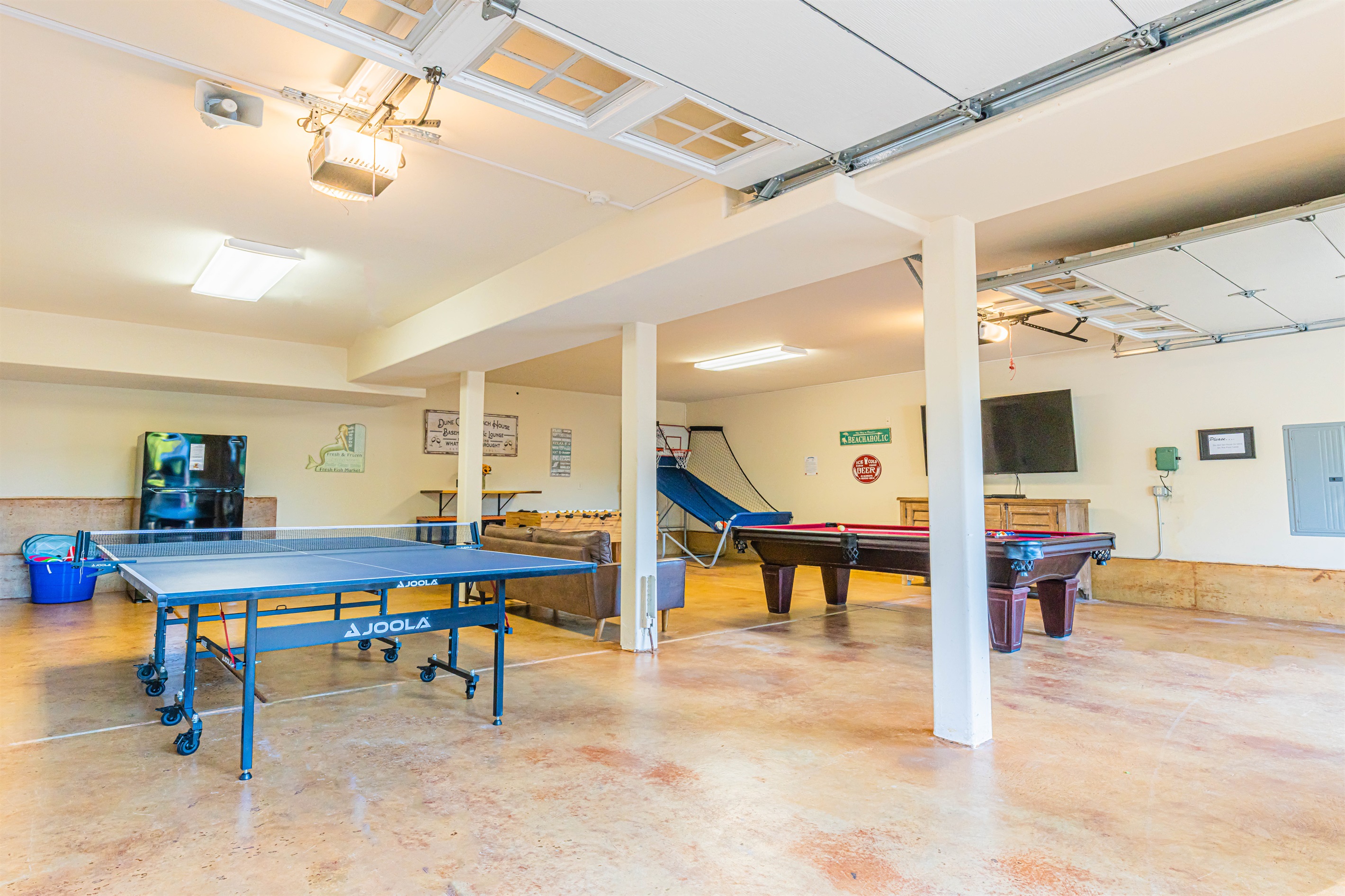 Super fun game room made for fun!  8' slate pool table, ping pong table, Foosball & Pop-a-Shot Basketball game.