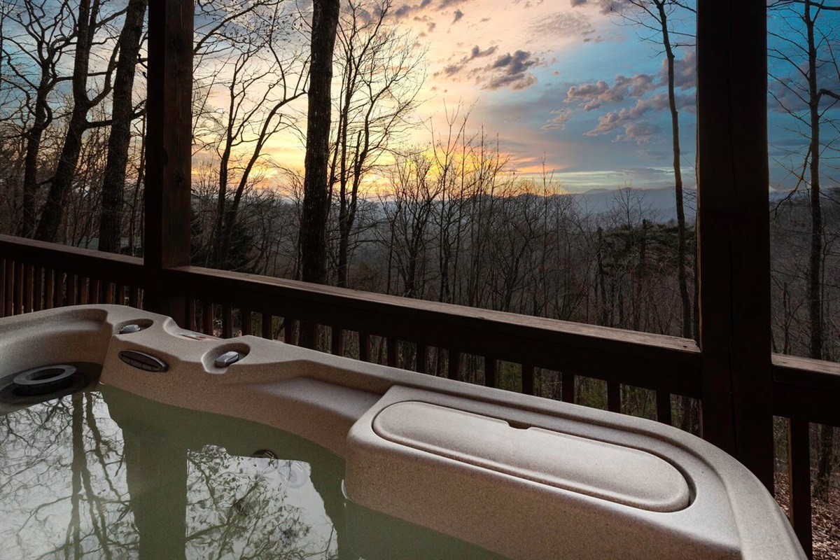 Photo from a guest. Hot ub on lower level patio has view of mountain/valley and sunset.  A table and two chairs are also down by the hot tub to place drinks, etc.