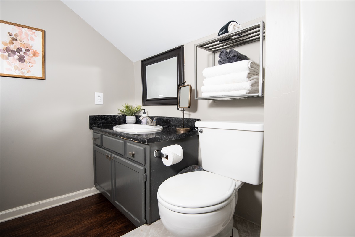 This fully stocked restroom in Unit G is also attached to a bedroom, making both bathrooms in this condo en-suite for added privacy.