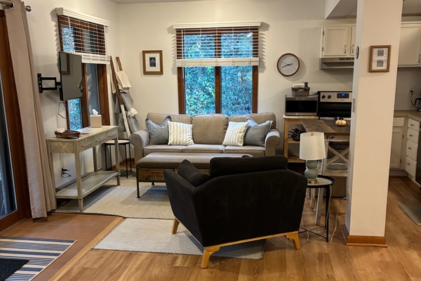 The living room offers a cozy space to spread out and relax.