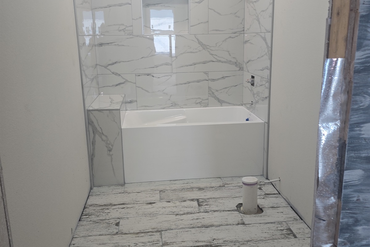 Bath with soaker tub