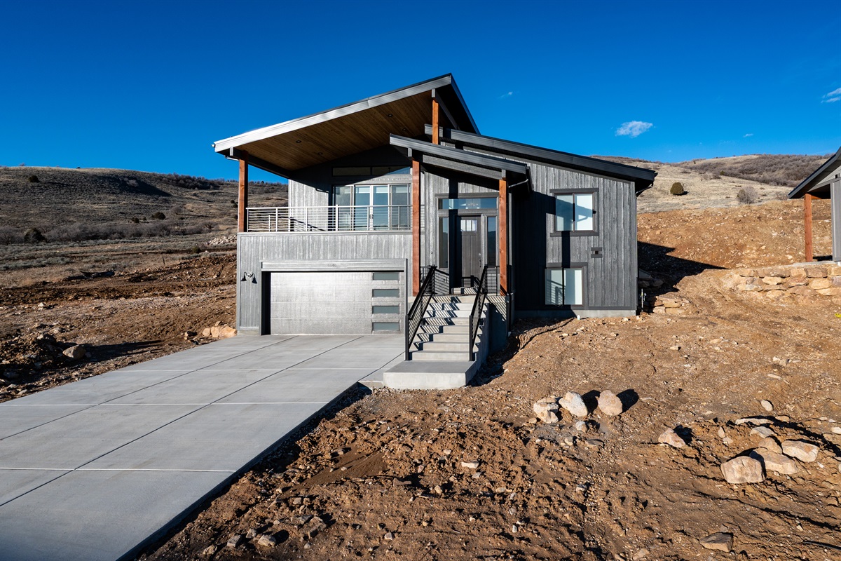 Modern mountain retreat with dramatic rooflines and panoramic views.