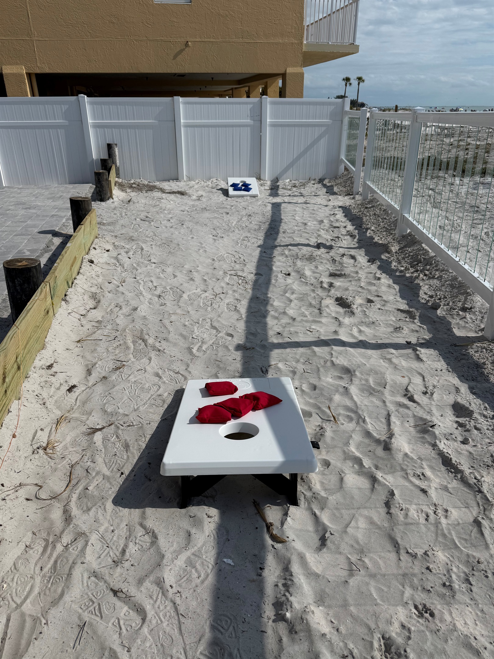 Play cornhole in the backyard with your family!