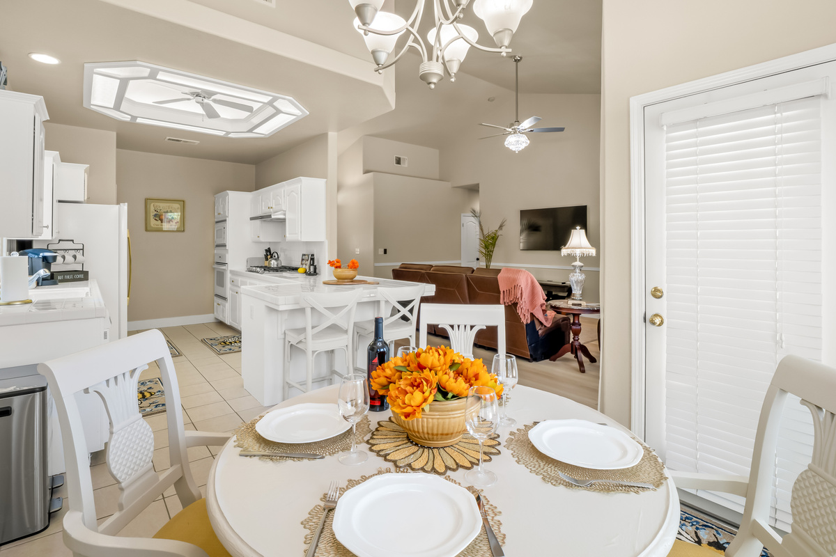 Enjoy meals together in this bright dining area that seamlessly connects to the kitchen and living room. The open layout keeps everyone connected, whether you're sharing breakfast, dinner, or planning the day's adventures.