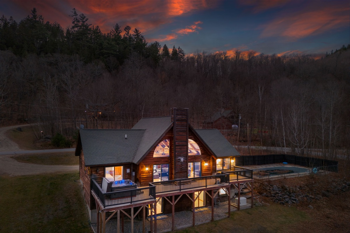 Escape to this stunning mountain cabin with glowing interiors, peaceful surroundings, and total privacy where your whole group can spread out and settle in for a true getaway.