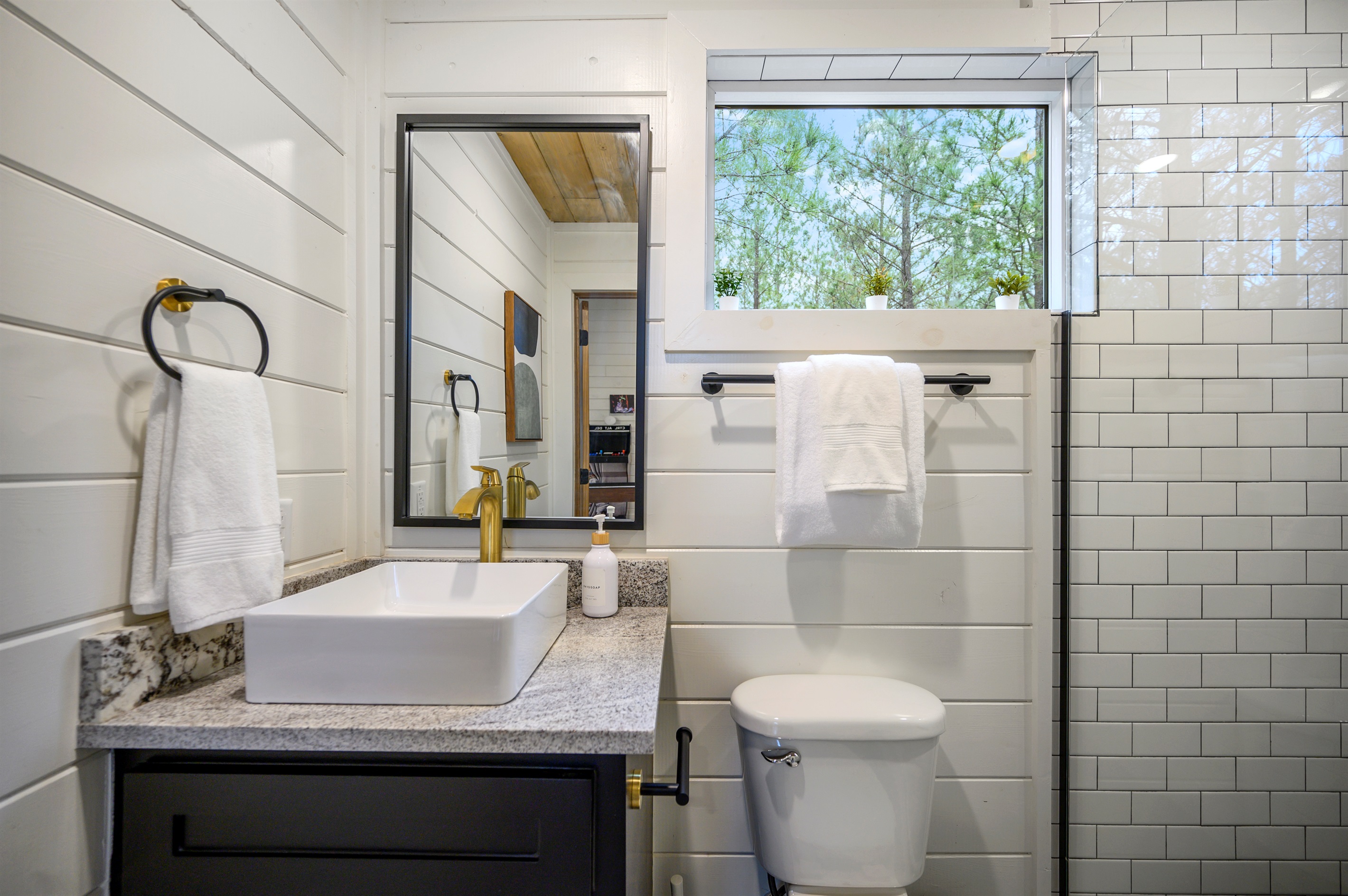 A clean and functional bathroom featuring a sink and toilet, designed for everyday comfort and convenience during your stay. ✨