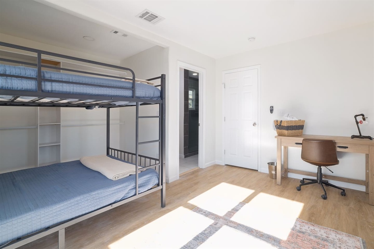 Bright and thoughtfully designed, this upstairs bunk room gives everyone space to relax, recharge, and settle in comfortably. Perfect for kids, friends, or extra guests after a day of adventure together.