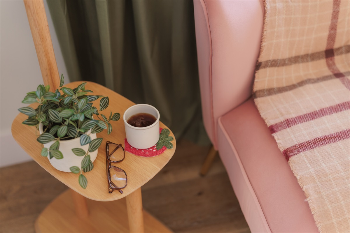 Reading Nook: Sip coffee on this charming side table while enjoying warm, inviting decor!