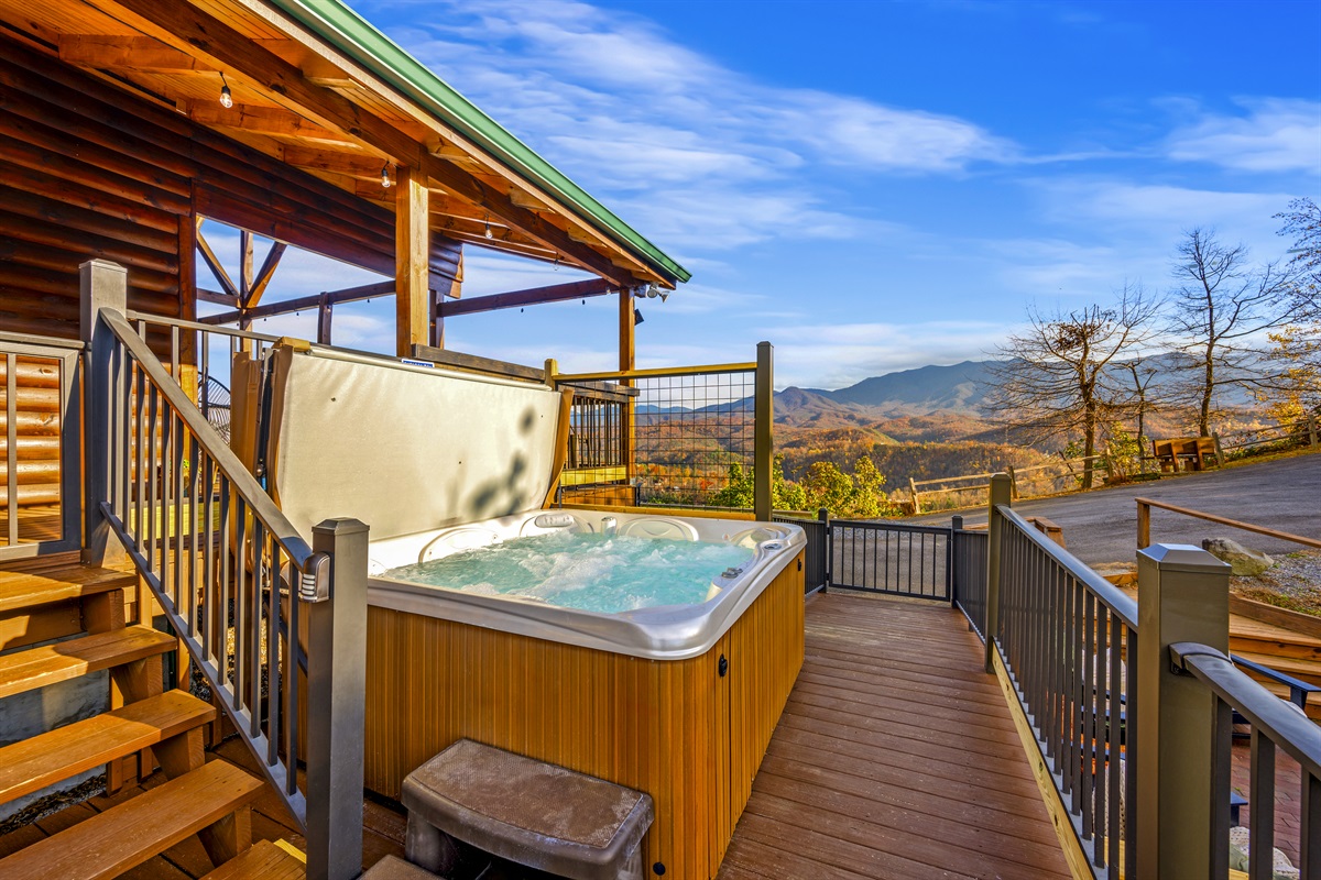 Soak in a private hot tub with stunning mountain views and experience the ultimate Smoky Mountain retreat