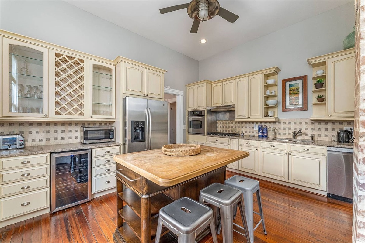 Bright, open kitchen with a new refrigerator (not pictured), wine fridge, and all of the appliances you'd expect in a high-end rental.  Gas stovetop and ample counter space to let the cook in your crew to work his/her magic.