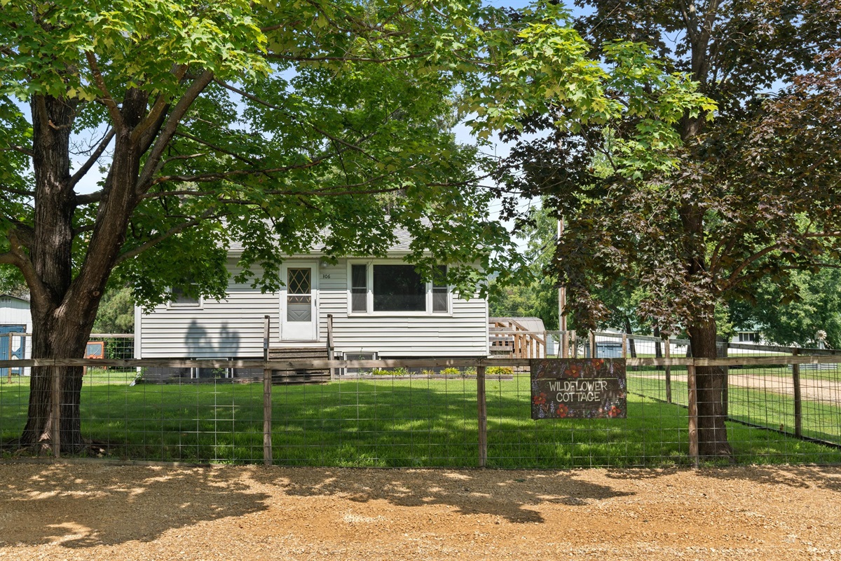 The large fenced front yard is shaded by two large maple trees. Parking is directly out front. 