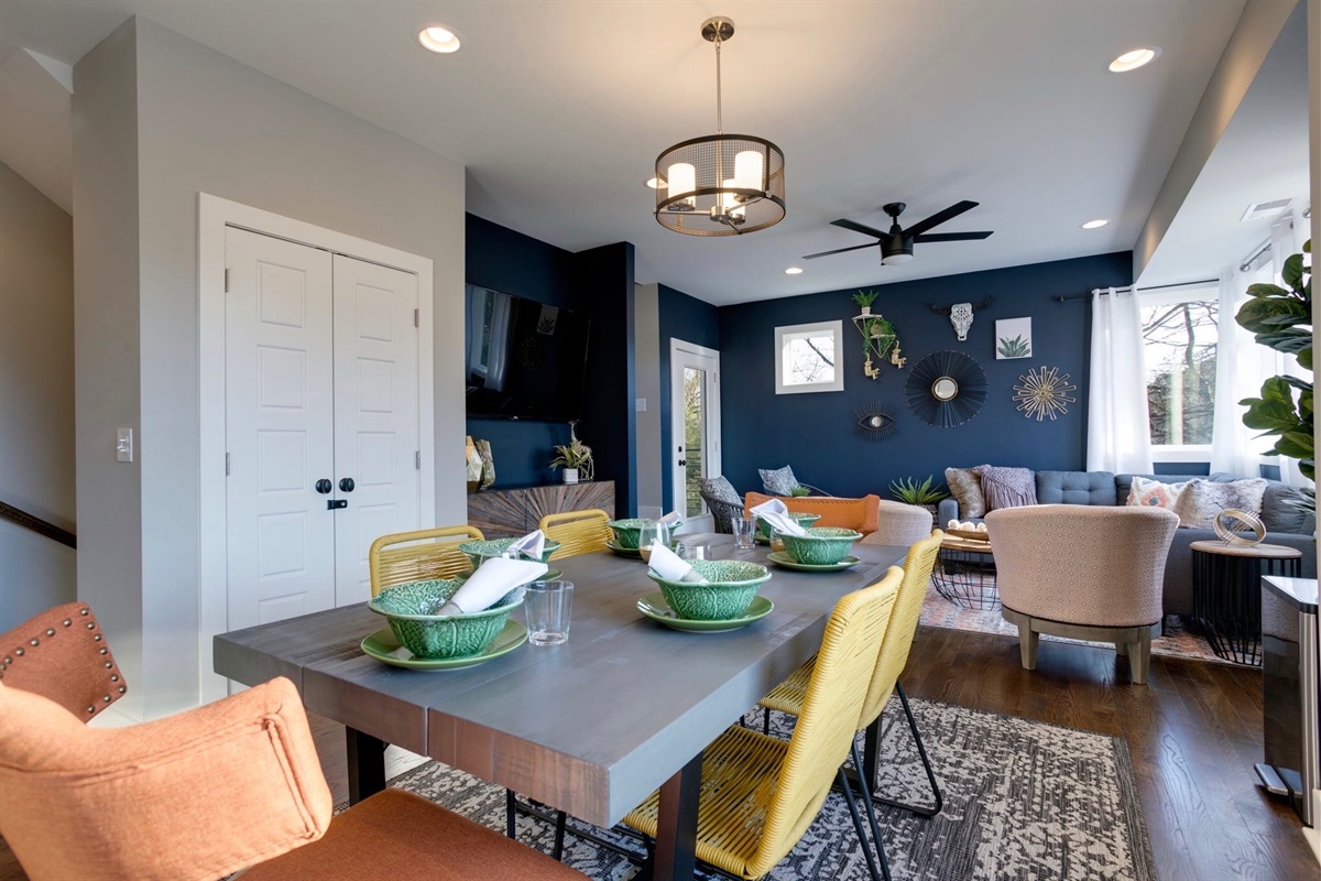 - Dine, laugh, and connect in this open concept space full of natural light - Eclectic seating and playful details make every meal feel like a celebration - Easy flow into the cozy living room, perfect for sharing moments and memories