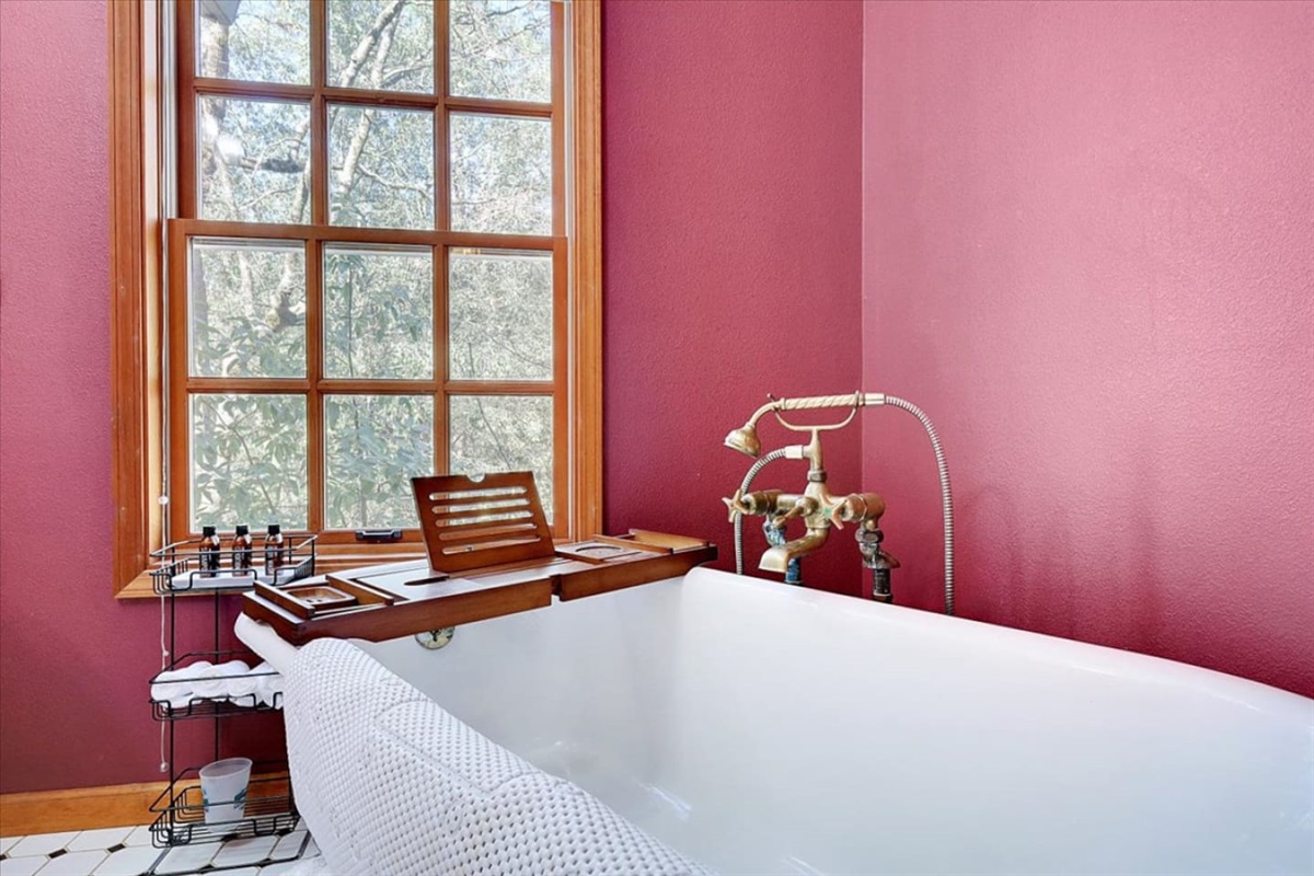 Full bathroom 2 with a clawfoot tub, pedestal sink, and a classic vintage-style look.
