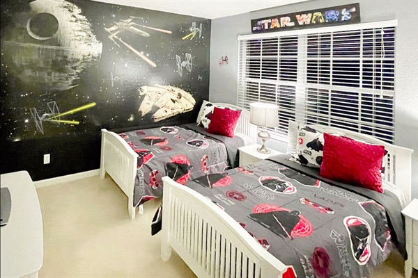 Star Wars themed bedroom with 2 twin beds.