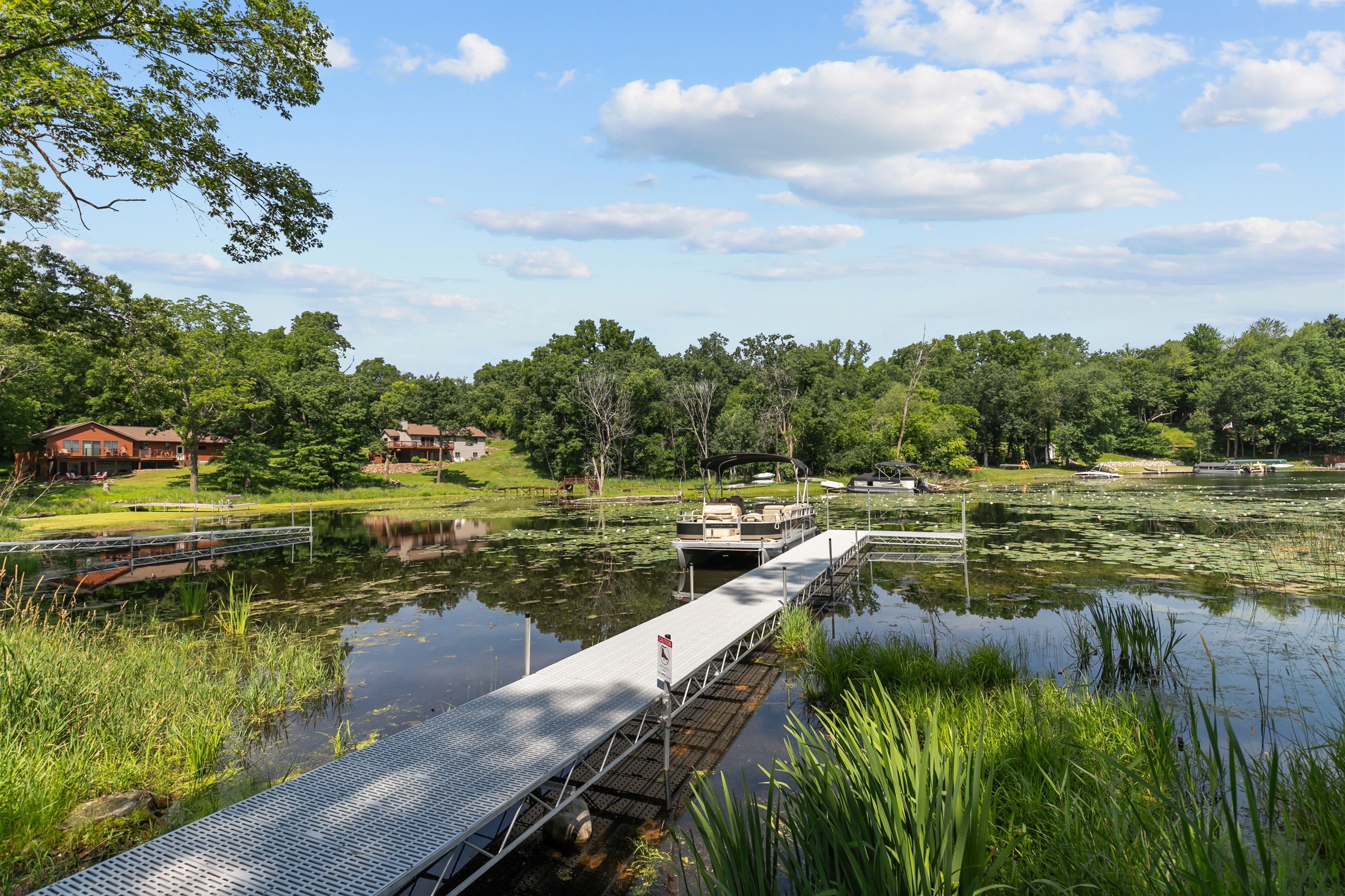 Framed by calm waters and open sky, the pier is the perfect place to take in the beauty of the lake