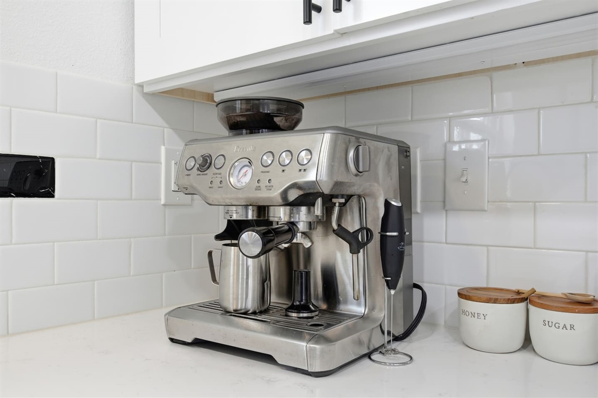Breville espresso machine and coffee station for morning lattes, cappuccinos, and fresh coffee at home.