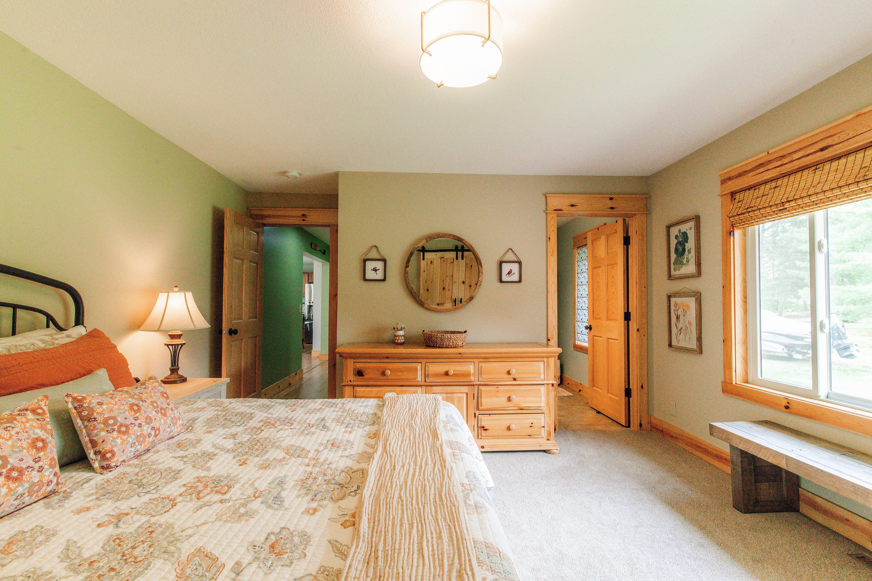 Relax in the spacious master bedroom featuring a luxurious king-sized bed and a private ensuite bathroom.