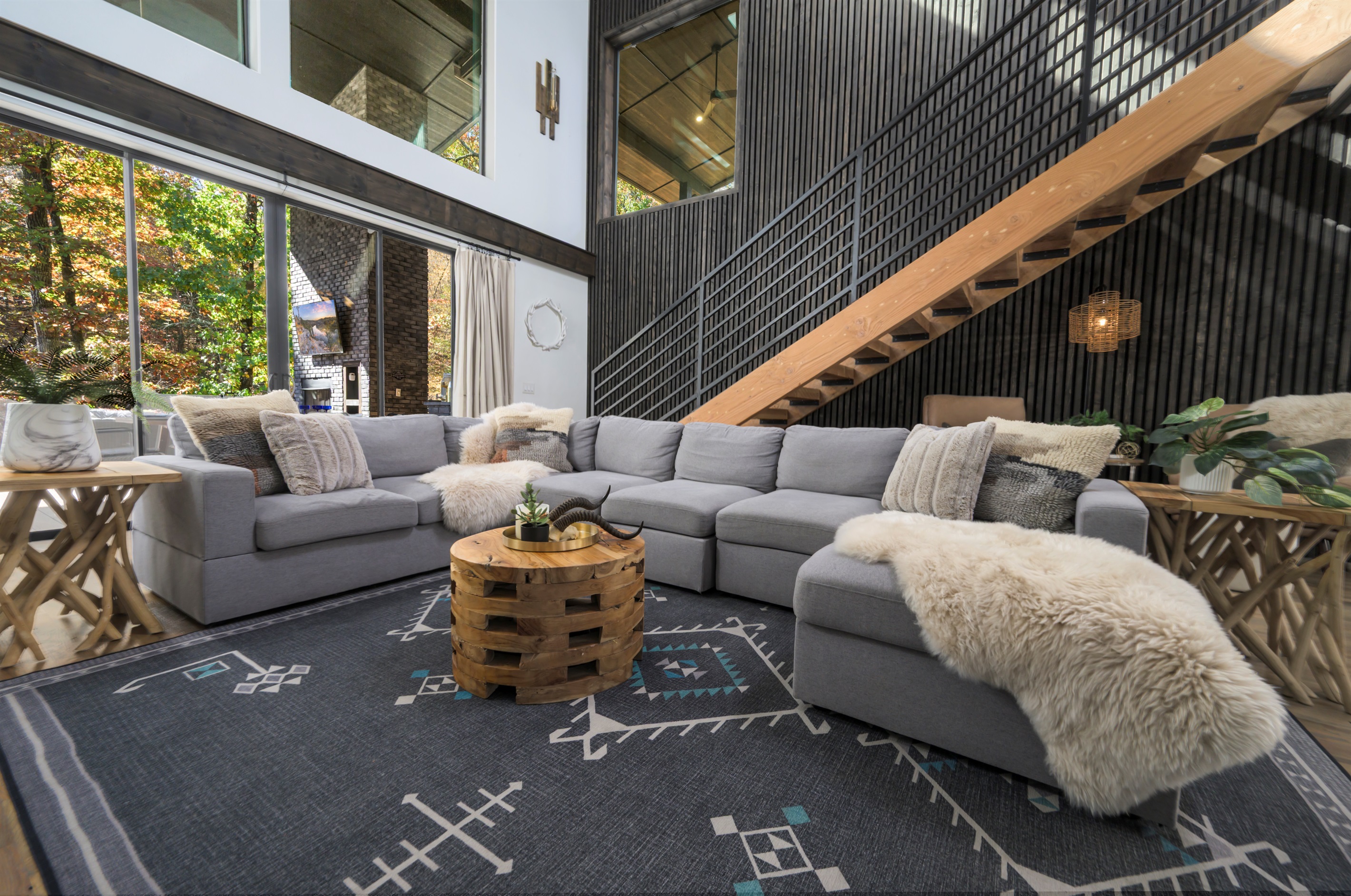 Open, airy, and inviting—this living space blends bold design with warm cabin comfort