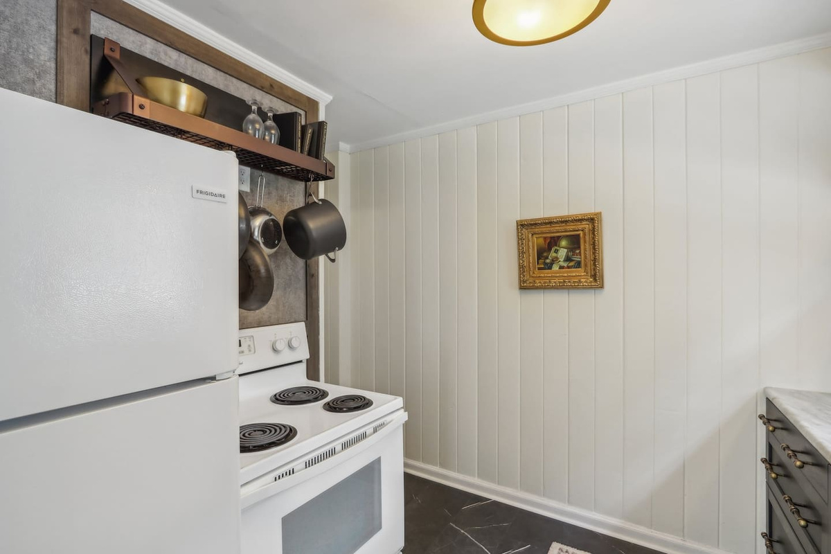Keep cooking simple with a full-size stove, handy storage, and a cozy kitchen setup designed for everyday convenience.