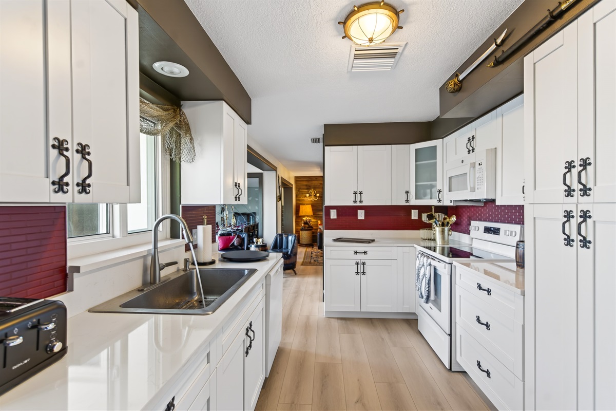 Fully equipped kitchen where modern comforts meet seafaring charm. Cook up a feast fit for captains and crew, or simply raid the fridge after a long day of adventure.