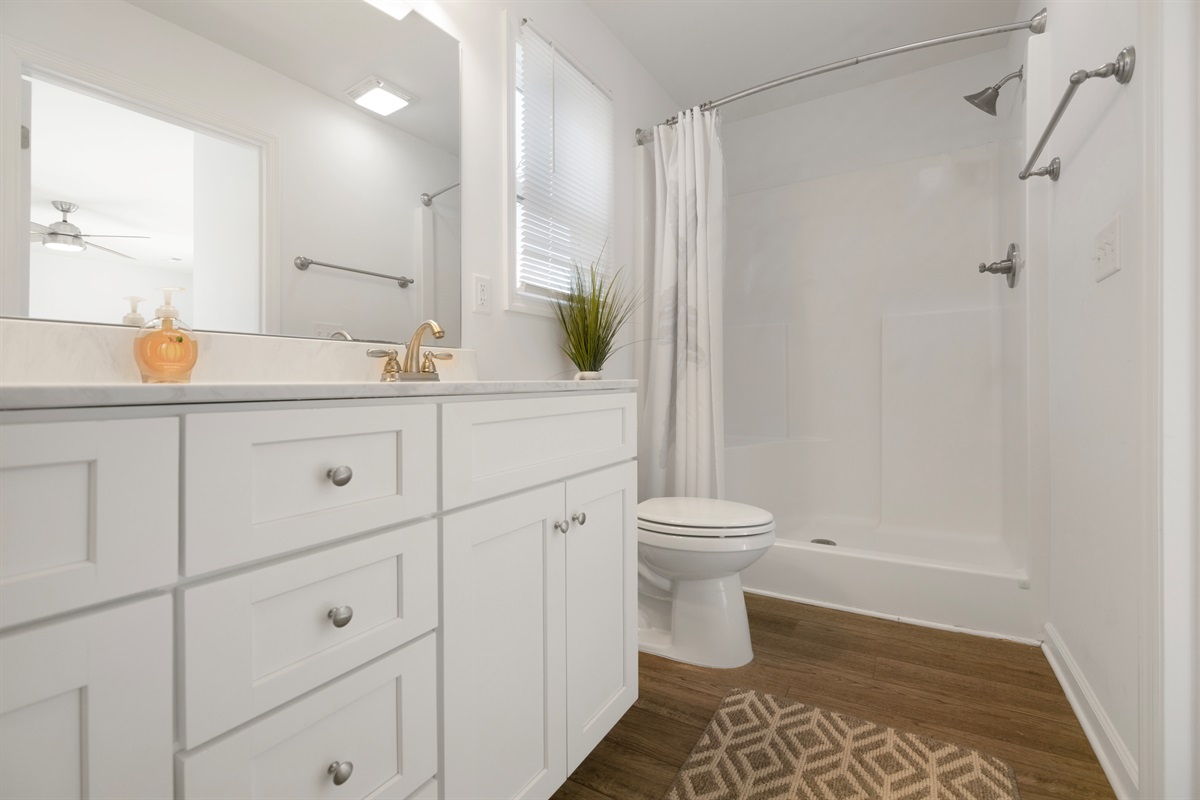 Clean, comfortable en-suite bathroom with shower