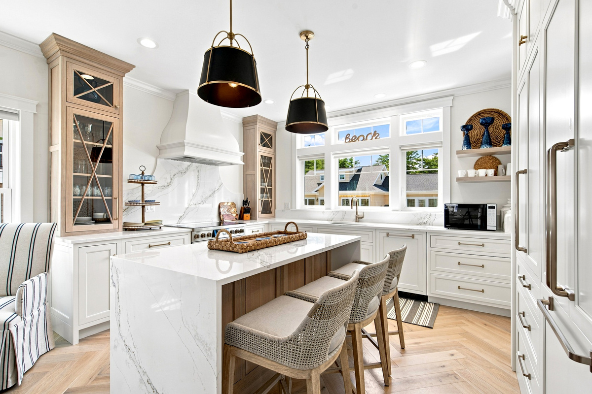 A spacious kitchen island with counter seating makes breakfast, snacks, and casual meals easy.