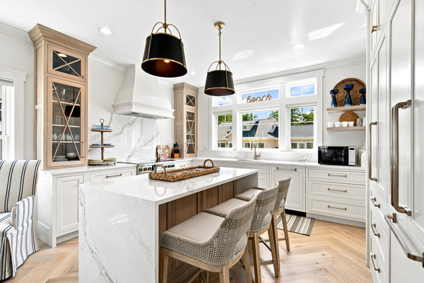A spacious kitchen island with counter seating makes breakfast, snacks, and casual meals easy.