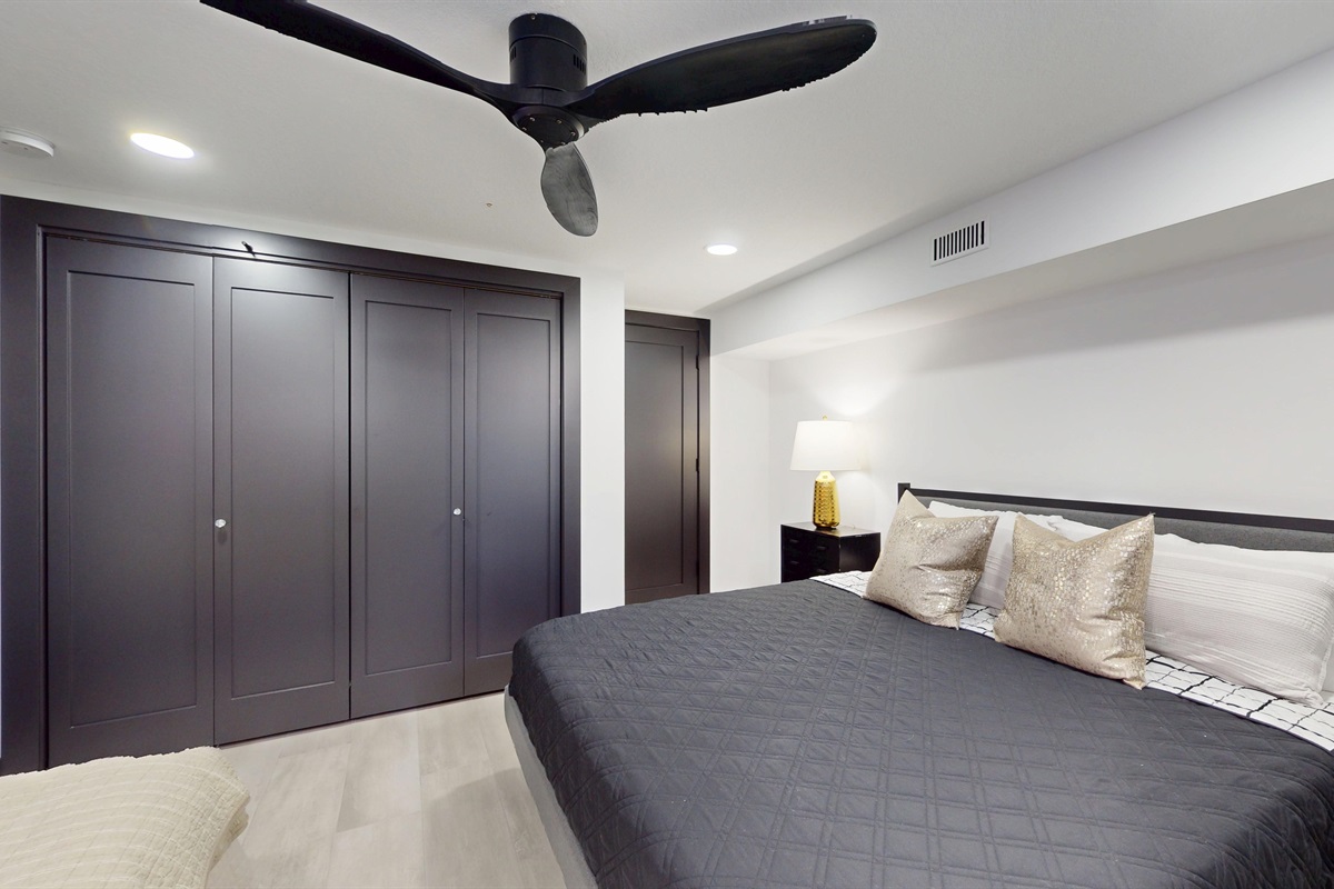 Lower level Primary Bedroom with closet and doorway to lower level Bathroom
