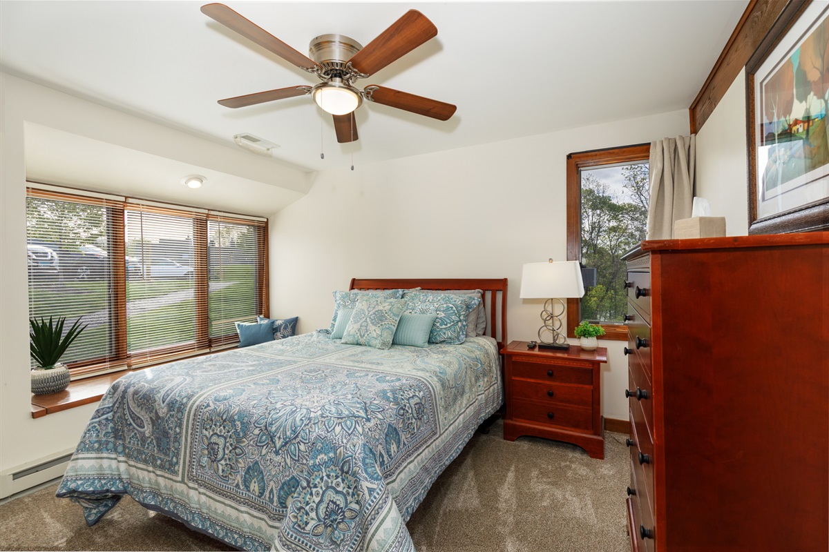 The main level bedroom features a Queen bed and ensuite bathroom