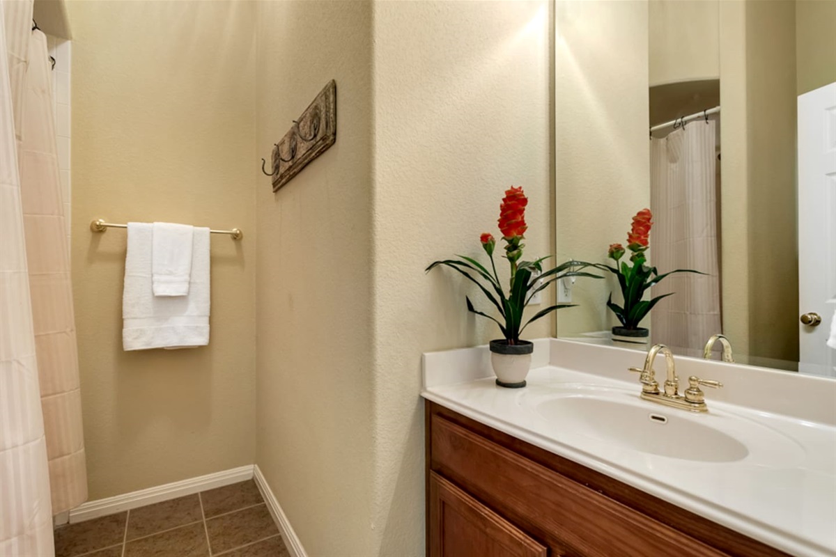 Guest full bath downstairs next to 2nd bedroom